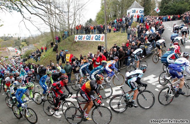 BMC Racing Team rider Gilbert of Belgium climbs the "Wall of Huy" during the Fleche Wallonne Classic cycling race in Huy